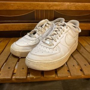 Air Force ones Nike white shoelaced up woman’s shoes.